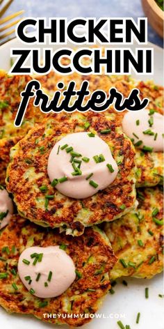 chicken zucchini fritters on a white plate with pink sauce and chives