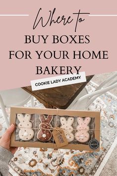 someone holding up a box full of cookies with the words where to buy boxes for your home bakery