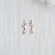 Rose Gold Bridal Earrings Designed With Small Leaves and Drops Beautiful earrings for brides and bridesmaids, designed with small leaves and drops and plated in rose gold. These small-leaf rose gold drop earrings are delicate and sparkly. The earrings offer a simple and elegant look. great to wear with your bridal and bridesmaids' dress and other outfits on any occasion after the wedding. These small drop earrings are made of cubic zirconia, lightweight, comfortable and sparkly, The earrings are Simple Bridal Jewelry Gold, Boho Bridal Earrings Gold, Simple Wedding Earrings Gold, Dainty Bridal Earrings, Short Dangle Earrings, Elegant Simple Gold Earrings, Dainty Silver Drop Earrings, Delicate Wedding Earrings, Wedding Day Jewelry Brides