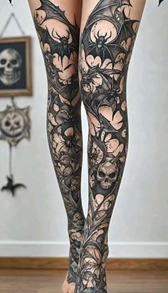 a woman's legs with tattoos on them