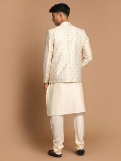 VASTRAMAY Men's Gold Woven Blazer And Cream Solid Kurta With Pajama Set This stylish set features a gold woven blazer paired with a cream solid kurta and pajama. Perfect for festive occasions, weddings, or formal events, this ensemble combines traditional elegance with contemporary flair. Key Features Gold woven blazer with intricate detailing Cream solid kurta with a comfortable fit Matching cream pajama Perfect for festive and formal occasions Specifications Blazer: Single-breasted with button Classic Cream Sherwani For Festive Occasions, Classic Cream Bandhgala For Festive Occasions, Designer Cream Nehru Jacket For Festive Season, Festive Gold Blazer For Semi-formal Occasions, Designer Beige Festive Sets, Festive Semi-formal Gold Blazer, Classic Gold Long Sleeve Sets, Festive Gold Semi-formal Blazer, Formal Off-white Sets For Diwali