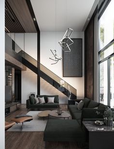 a living room with couches, coffee table and stairs leading up to the second floor