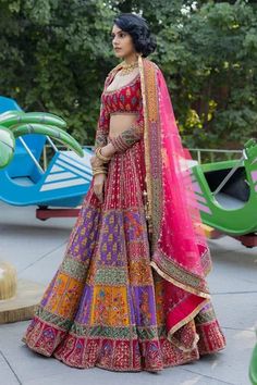 Multi color georgette flared lehenga with attached can-can, all over contrast geometric print panels, beads, metallic gold zari and sequin hand embroidery. Paired with deep round neck embroidered padded blouse with full sleeves and pink net dupatta.
Components: 3
Pattern: Hand Embroidered and Printed
Type Of Work: Bead, Zari, Sequin Work and Geometric Print
Neckline: Deep Round Neck
Sleeve Type: Full Sleeves
Fabric: Georgette, Net
Color: Multi Color
Other Details: 
Fringe tassel border on dupatt Blouse With Full Sleeves, Gown Party Wear, Rakhi Design, Designer Party Wear Dresses, Chaniya Choli, Net Dupatta, Party Wear Dresses, Full Sleeves, Bridal Lehenga