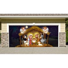 a garage door with an image of the birth of jesus and baby jesus on it