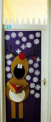 the door is decorated with reindeers and snowflakes