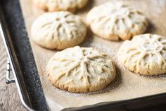 six cookies on a baking sheet ready to be baked