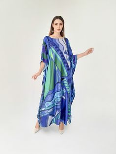 A full length kaftan made by blended silk and completed with art print inspired by simple abstract The fabric is easy to take care by both washing and ironing. It is smooth and silky. FEATURES - Vivid color vibrant - abtract - Custom Length Kaftan - Full Length Kaftan Sleeves Kaftan - Luxury Design Silk Kaftan - Plus Size and Custom Length - Resort Wear, Beach Wear, Lounge Wear, Christmas Gift Idea - Boat/Crew Neck - Plus size kaftan -------------------------------- DETAIL  * The size can be adjusted to fit up to 5 XL. Bust/ Waist/ Hip up to 55 inches ( 105 inches full circumference) * Length of the kaftan could be max. 55 inches. All length will be custom made accordingly the personal-full-height (No extra fee charged for request to make longer, shorter or narrow both length and width) * Luxury Blue Printed Kaftan, Luxury Blue Dresses With Vibrant Print, Kaftan Simple Silk, Luxury Blue Kaftan For Women, Luxury Blue Women's Kaftan, Kaftan Sleeves, Blue Kaftan, Silk Caftan, Silk Kaftan