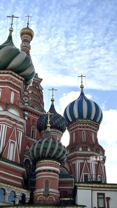 an ornate building with domes and crosses on top