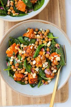 two bowls filled with spinach and chickpeas