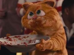 an orange cat standing on its hind legs holding a white plate with blood all over it