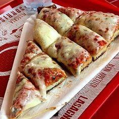 several slices of pizza sitting on top of a tray