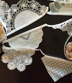 several pieces of white lace are on display