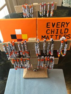 there is a display made out of beads and burlocks on top of a table