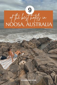 a woman laying on rocks near the ocean with text overlay that reads 9 of the best spots in noosa, australia