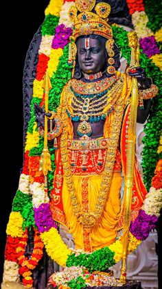 the statue of lord rama is surrounded by flowers