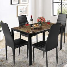 a dining room table with chairs around it