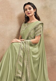 Pista green satin silk saree with blouse 42010  Desc:  Color : Pista Green Saree Fabric : Satin Silk Work : Embroidery Wash Care : Dry clean Sleeve Style : Half Sleeve Long Sleeves : Done only in Custom Stitch Sleeves Lining : Done only in Custom Stitch Bust Size : 34 to 40 Inches Occasion : Wedding   Kitty Party   Mehendi   Sangeet   Party Wear   Reception   Gudi Padwa. With Express Free Shipping and Custom Stitching, Buy Indian Party wedding wear Bridal saris Pista green satin silk saree with Half Saree Designs Simple, Pista Green Saree, Green Blouse Designs, Green Sari, Satin Silk Saree, Bridal Sari, Simple Lehenga, Simple Saree Designs, Indian Sari Dress