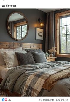 a large bed sitting under a round mirror in a bedroom next to a dresser and window