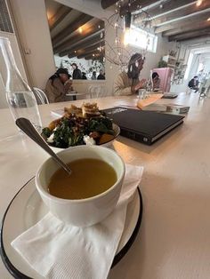 a bowl of soup is sitting on a table