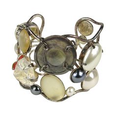 Stunning array of Mabe pearls, crystal and mother of pearl discs. Made in France. Bezel and prong set. Large oversized Cuff. Measuring 2.44 in top to bottom. Will fit a 6.5 to 7.5 wrist nicely. Can be adjusted a bit larger or smaller. This came from a huge estate of Jewelry that was purchased in the late 80s early 90s stored away till now. Philippe Ferrandis is an internationally renowned, French jewelry designer with over 25 years of dedicated work in his chosen art form. He is widely recognize Oversized Jewelry, Bezel Jewelry, Diamond Cuff Bracelet, Pearl Cuff Bracelet, Floral Cuff, Pearl Cuff, French Jewelry, Art Jewelry Contemporary, Mabe Pearl