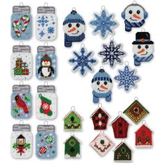 cross stitch christmas ornament kits with snowman, penguin and house designs on them