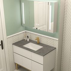 a bathroom with a sink and mirror in it