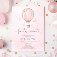 a pink birthday party with balloons and confetti