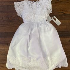 Isabel Garretn White Girls Dress (Size 5) 50% Polyester, 35% Cotton, 15% Rayon Nwt Bin_220 Fitted Dresses For First Communion In Spring, Sleeveless Fitted First Communion Dress With Lace Trim, Spring First Communion Dress With Short Sleeves, Fitted Short Sleeve Lace Dress For Dress-up, Fitted Short Sleeve Lace Dress For Dress-up Occasions, Fitted Short Sleeve First Communion Dress For Spring, Fitted First Communion Dress For Spring, Spring Fitted Lace Dress For First Communion, Fitted First Communion Dress With Lace Trim For Spring