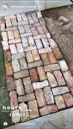 an old brick walkway is laying on the ground