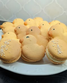 there are many cookies shaped like animals on the plate