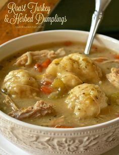 a white bowl filled with soup and dumplings