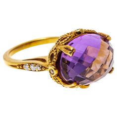 14k yellow gold ring. This curious and unusual ring features a center checkerboard oval faceted, medium to light purple color amethyst, approximately 7.21 CTS, and mirrored on the underside by a matching checkerboard oval faceted, medium orange color citrine, approximately 7.15 CTS, which gives the illusion of orange flashed coming through the purple top of the amethyst. The amethyst is set with split prongs, and set with a bow decorated gallery, punctuated by round faceted, bezel set diamonds, Amethyst Cocktail Ring, Amethyst And Citrine, Light Purple Color, Unusual Rings, Amethyst And Diamond Ring, Bezel Set Diamond, Citrine Ring, Modern Ring, Shiny Things