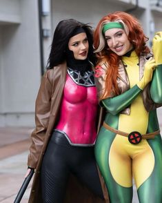 two women dressed in costumes posing for the camera