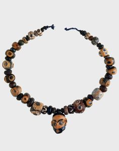 Phoenician-made necklace with glass eye beads and a central head pendant, recovered from Grave 1 at Tharros, Sardinia.  ca. 600 - 300 BC. | Collection: British Museum, London. | Pg 313 "The Worldwide History of Beads" by Lois Sherr Dubin. 2009 edition. Hellenistic Jewelry, Classical Jewelry, Ancient World History, British Museum London, Punic Wars