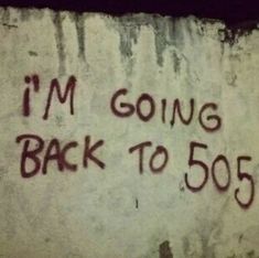 graffiti on the side of a building that says i'm going back to 505