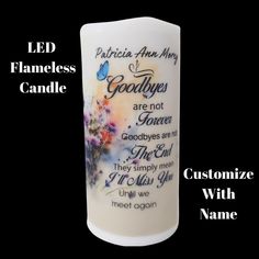 a white candle with the words godly are not given, and an image of flowers on it