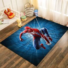 a spiderman rug on the floor in a child's room