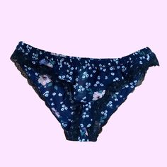 Gorgeous Navy Blue Sheer Floral Bikini Panty! Brand New With Tags And Never Tried On/Worn. These Have A Black Lace Trim. Floral Pattern Is White, Pink, Purple, And Green. Brand Is Topshop. Size Us 4 - Best Fits S. Flat Measurements: Waist: 12” Length: 8.5” Blue Lace Trim Beach Bottoms, Blue Lace Trim Bottoms For Beach, Lace Trim Brief Bottoms For Beach, Summer Swimwear With Lace Trim Briefs, Summer Swimwear With Lace Trim And Brief Shape, Black Lace Trim, Blue Sheers, Lingerie Outfits, Lace Lingerie Set