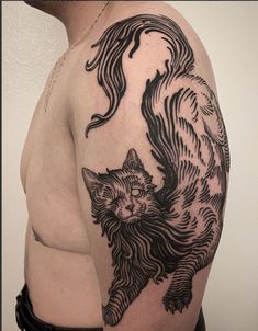 a man with a cat tattoo on his arm