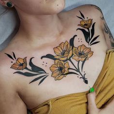 a woman with yellow flowers on her chest