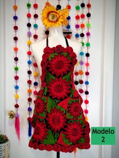 a mannequin is decorated with flowers and beads