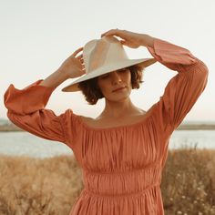 Accented with a sweeping 3-toned stripe design, this hand-woven hat adds a stylish touch to your warm-weather wardrobe. Made from Paja Toquilla straw and artisan-crafted in Ecuador. Spring Coastal Boater Hat Made Of Toquilla Straw, Spring Woven Toquilla Straw Fedora, Fitted Woven Straw Hat For Spring, Spring Fitted Woven Straw Hat, Woven Straw Hat With Curved Brim For Spring, Spring Straw Hat With Curved Brim And Woven Detail, Spring Straw Hat With Woven Curved Brim, Chic Handwoven Toquilla Straw Panama Hat, Chic Handwoven Fedora Straw Hat