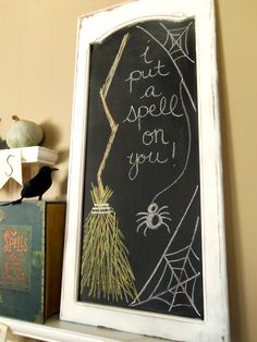 a chalkboard with writing on it next to other items