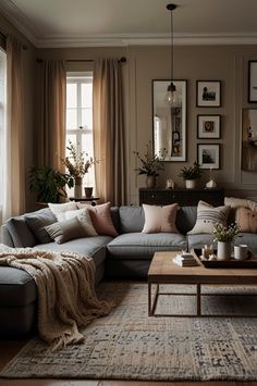 How to achieve the ultimate cozy living room with these decor ideas. From oversized throws to ambient lighting, find inspiration to create a comforting space. Ideal for relaxing with a good book or hosting friends in style. Grey Beige And Tan Living Room, Gray Couch Tan Walls Living Room, Neutral Theme Apartment, Beige Living Room With Grey Sofa, Cozy Living Rooms Beige, Grey Couch Cream Walls, Rustic Living Room Color Scheme, Sage Grey Living Room, Grey Walls Interior Design