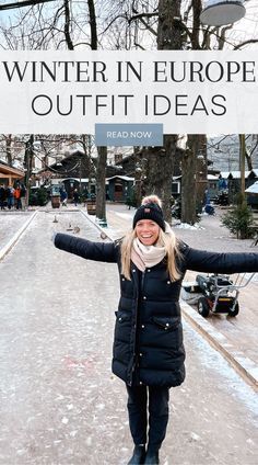 a woman is standing in the snow with her arms spread out, and there is a sign that says winter in europe outfit ideas