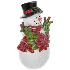 a snowman with a hat, scarf and poinsettia is standing in front of a white background