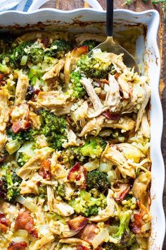 a casserole dish filled with broccoli and chicken