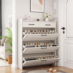 a white shoe rack filled with lots of shoes