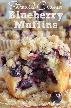 blueberry muffins stacked on top of each other with crumbs in the middle