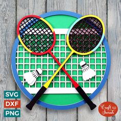 two tennis racquets on top of a plate with the words svg dxf file next to it